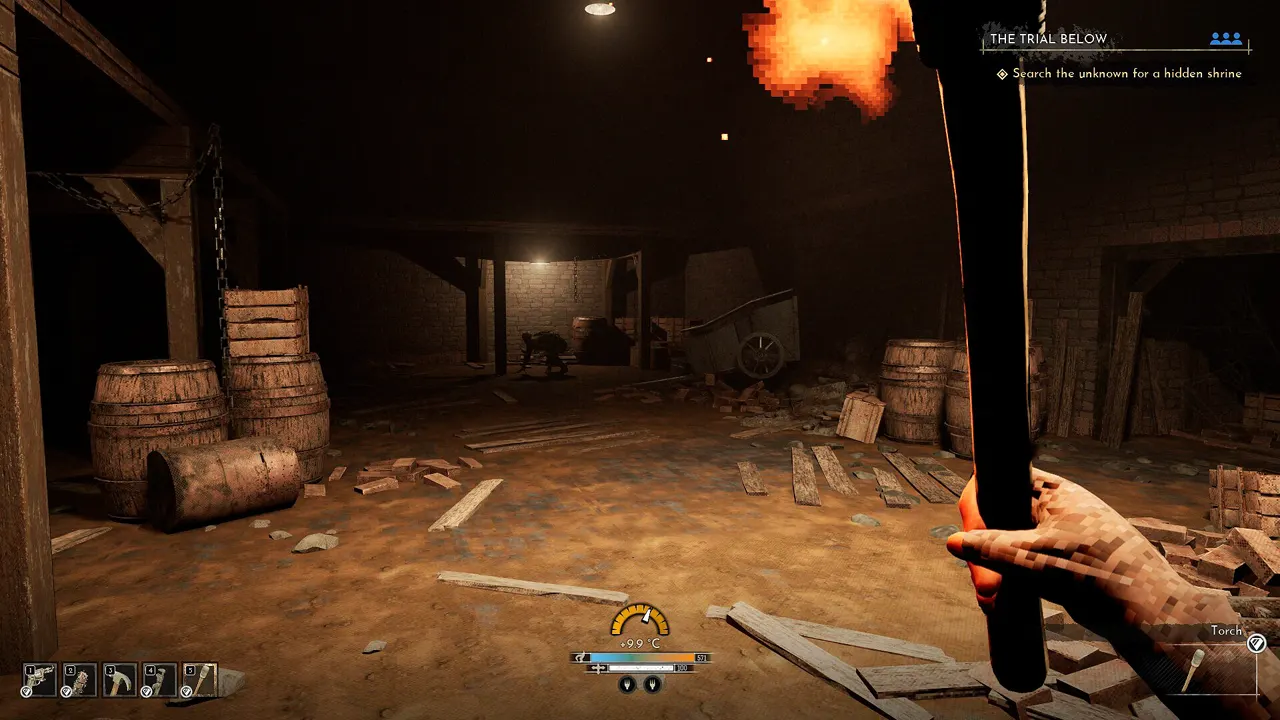 A lit torch held inside a dark Frostrail dungeon
